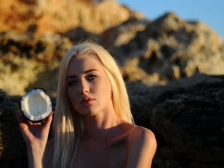 beautiful woman holding a coconut shell